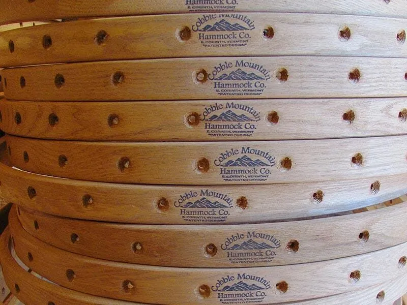 A stack of Cobble Mountain Oak frames with the Cobble Mountain Logo stamped on them in the middle