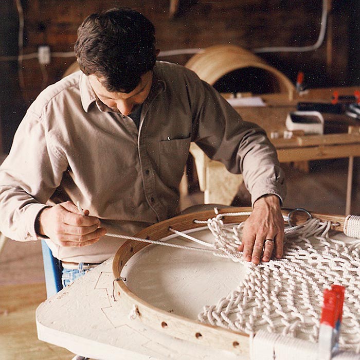 Man working on assembling a Hammock Chair