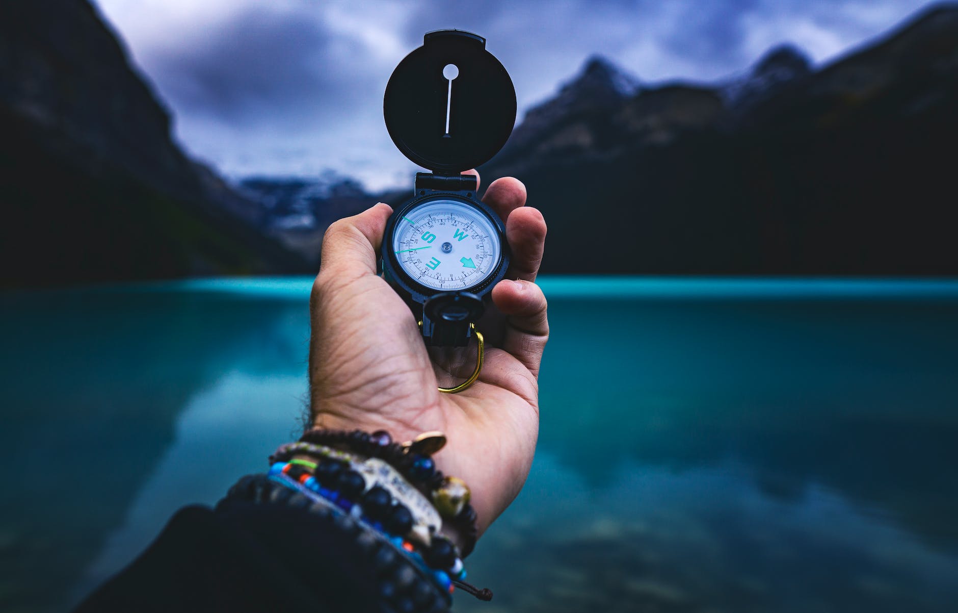 person holding a compass