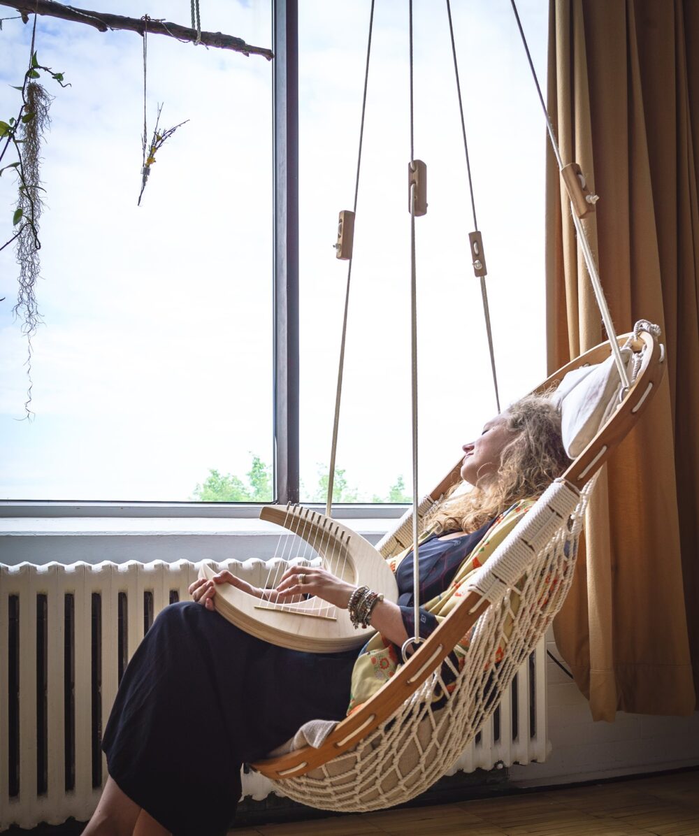 woman relaxing in hammock chair, self-care