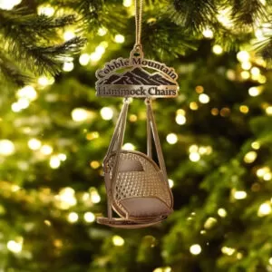 A Cobble Mountain Keepsake ornament hanging from a decorated Christmas tree.